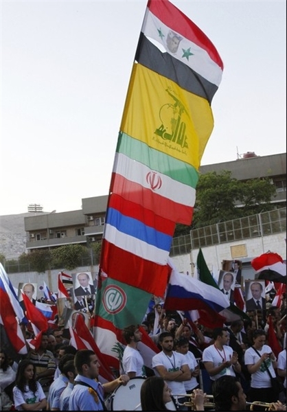 برافراشتن پرچم ایران و حزب الله مقابل سفارت روسیه +عکس