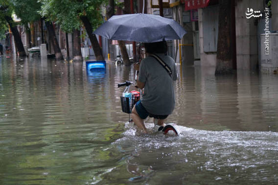 بارش باران تابستانی در چین (+عکس)
