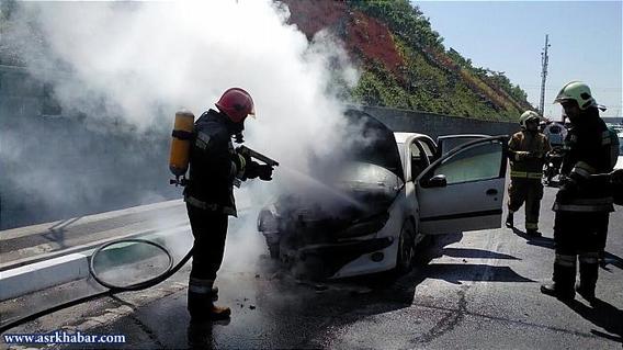 آتش سوزی پژو 206 در همت (عکس)